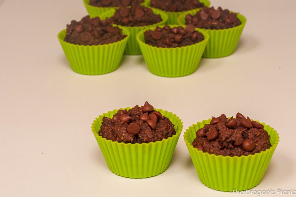 close up of a selection of chocolate pumpkin muffins in cases ready to bake