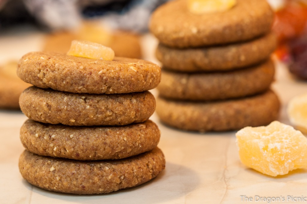 stack of four raw ginger bites biscuits with stack of four more biscuits in background